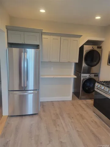 a kitchen with a refrigerator and cabinets