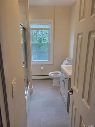 a bathroom with a toilet sink and tub