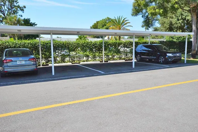 a view of street with a car parked