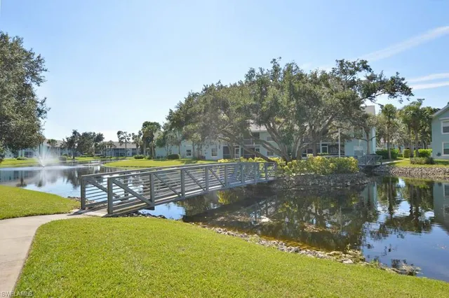 a view of a lake with a yard