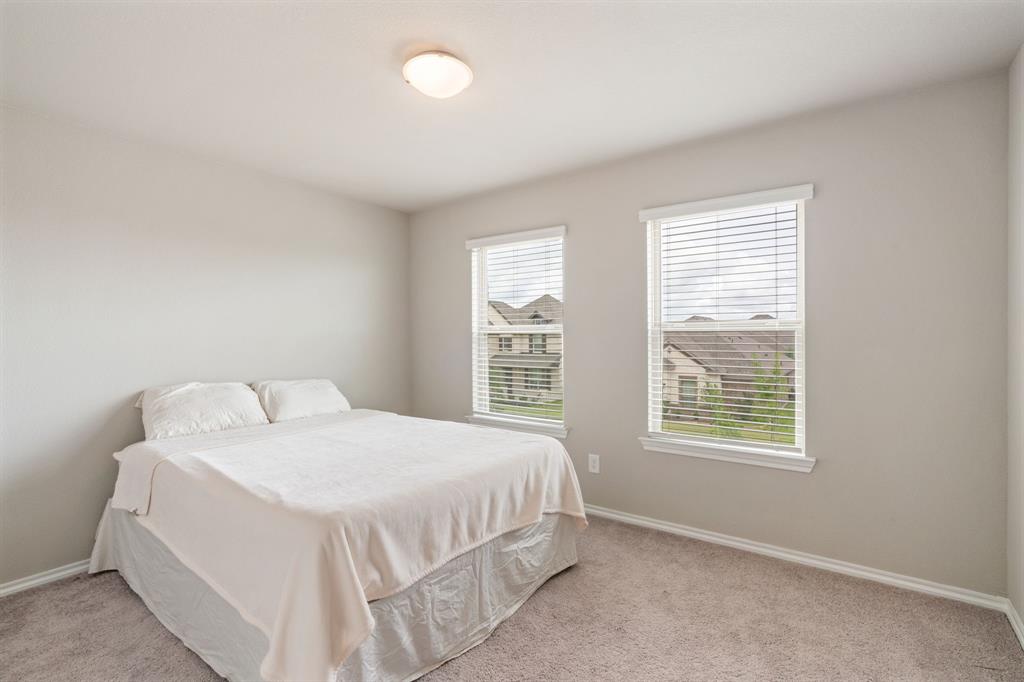 321 Pasture Drive Midlothian, TX 76065 - Photo 31 of 40 a bedroom with a bed and a window