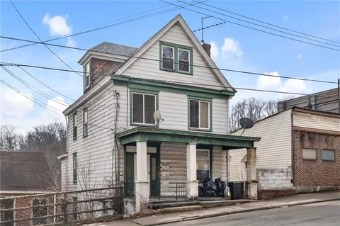 a front view of a house with a garage