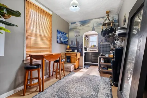 a kitchen with a refrigerator and a sink