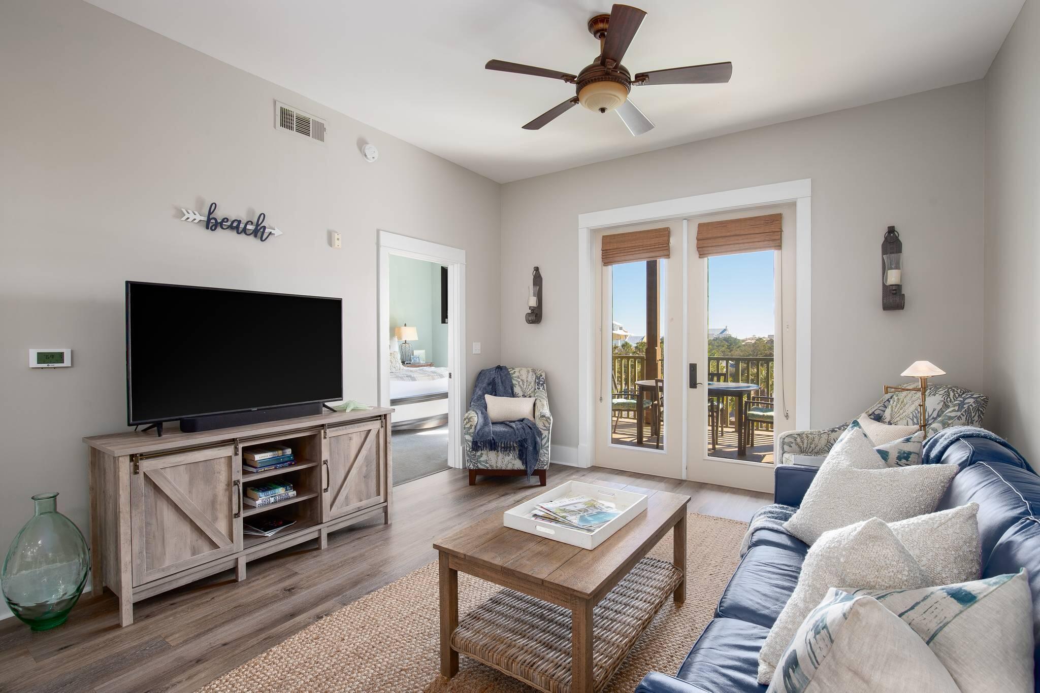 2050 West County Highway 30A, Unit M1310 Santa Rosa Beach, FL 32459 - Photo 13 of 63 a living room with furniture and a flat screen tv