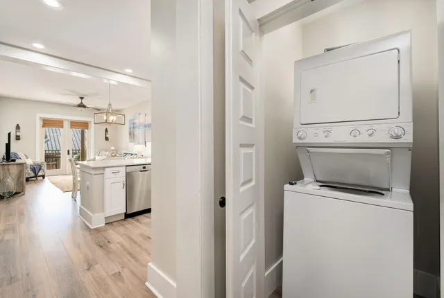 a view of a roof deck with chair and wooden floor