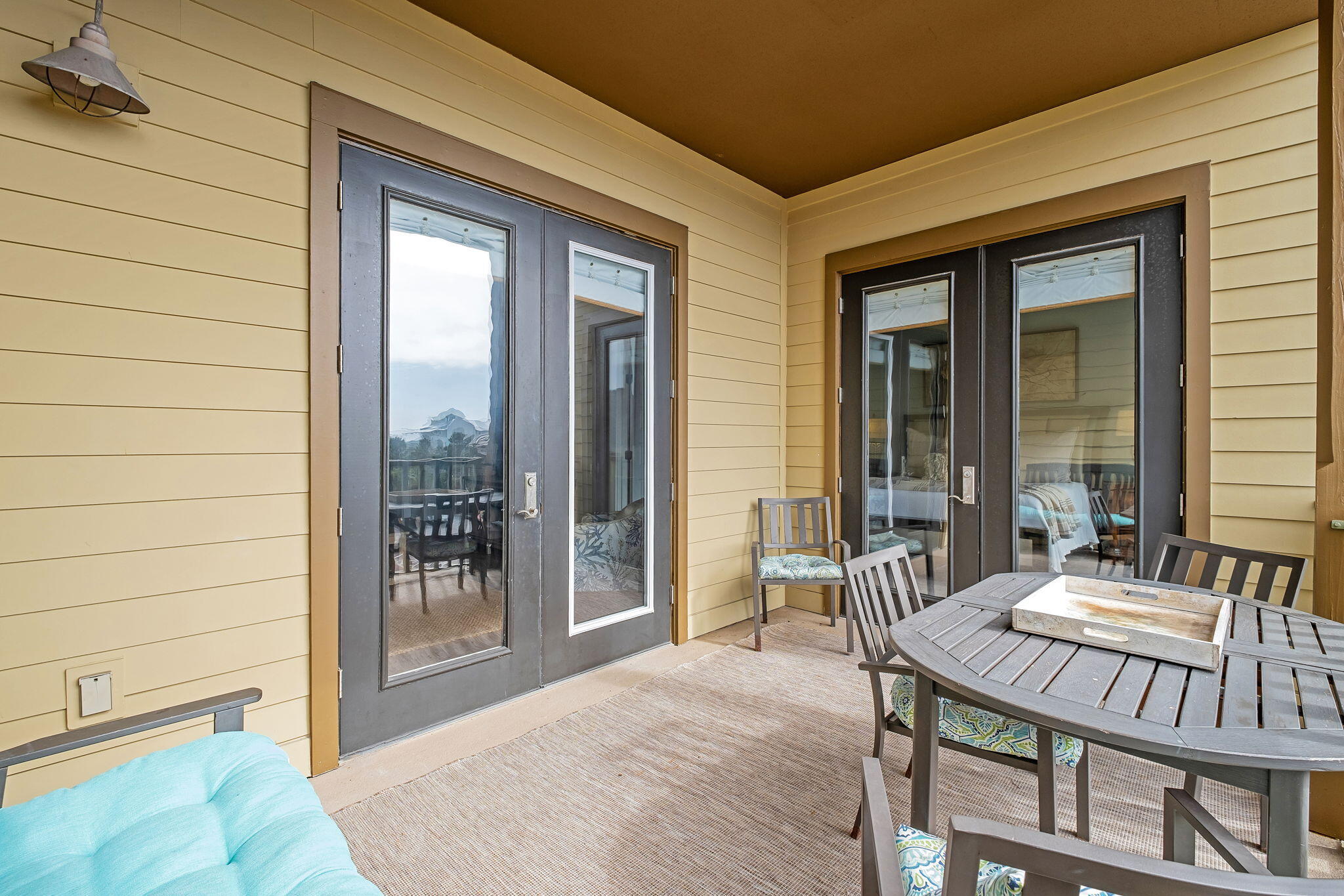 2050 West County Highway 30A, Unit M1310 Santa Rosa Beach, FL 32459 - Photo 29 of 63 a view of a patio with a table and chairs