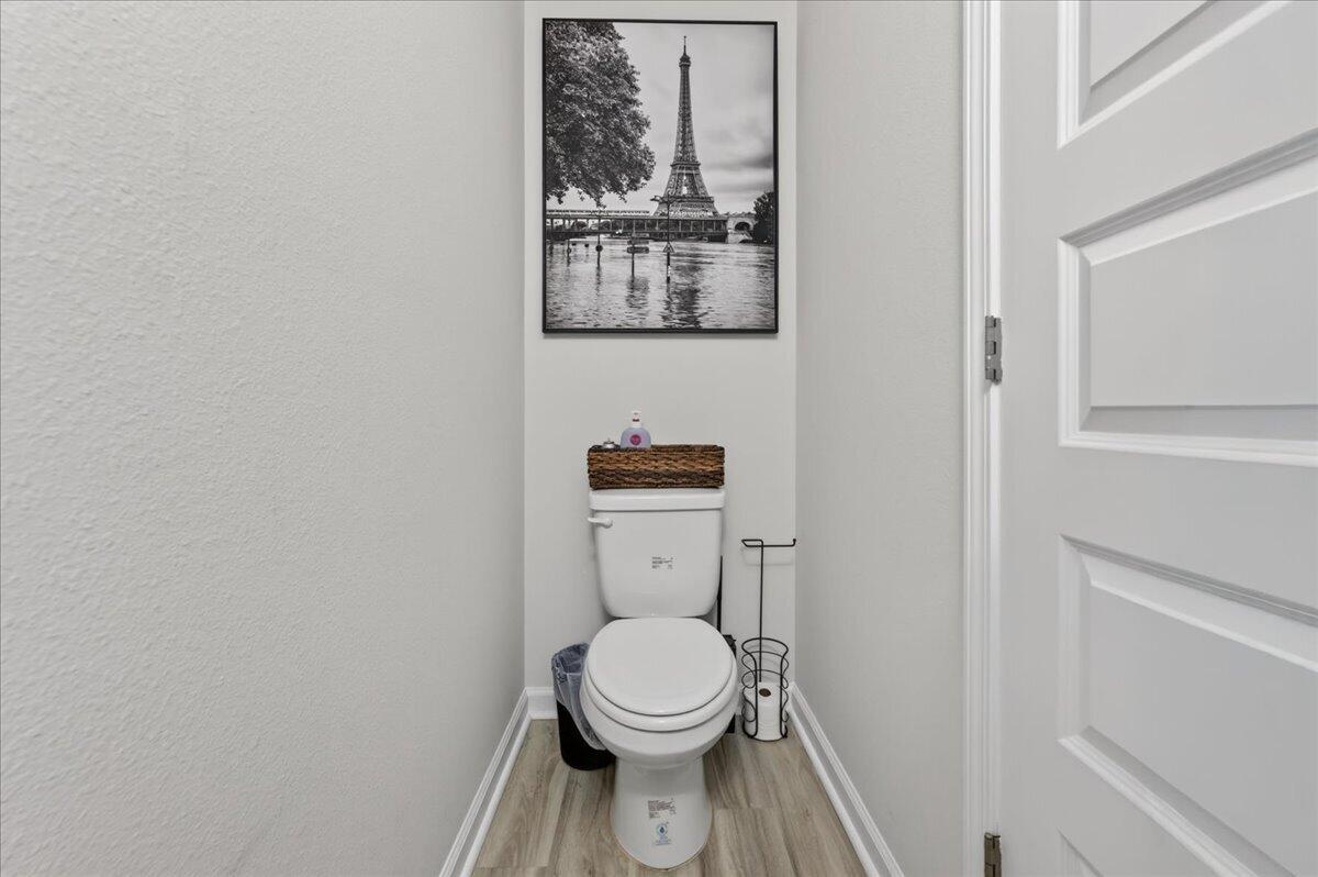 2808 Tallgrass Court Crestview, FL 32536 - Photo 18 of 49 a white toilet sitting next to a white cabinet