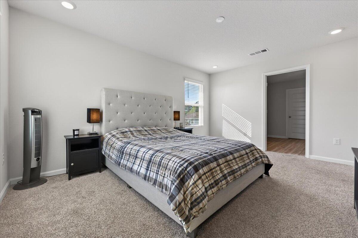 2808 Tallgrass Court Crestview, FL 32536 - Photo 24 of 49 a bedroom with a bed and a dresser