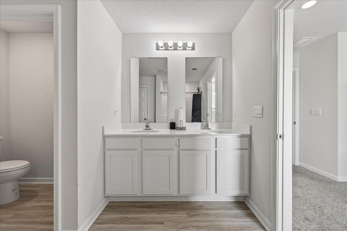 2808 Tallgrass Court Crestview, FL 32536 - Photo 27 of 49 a bathroom with a double vanity sink and a mirror
