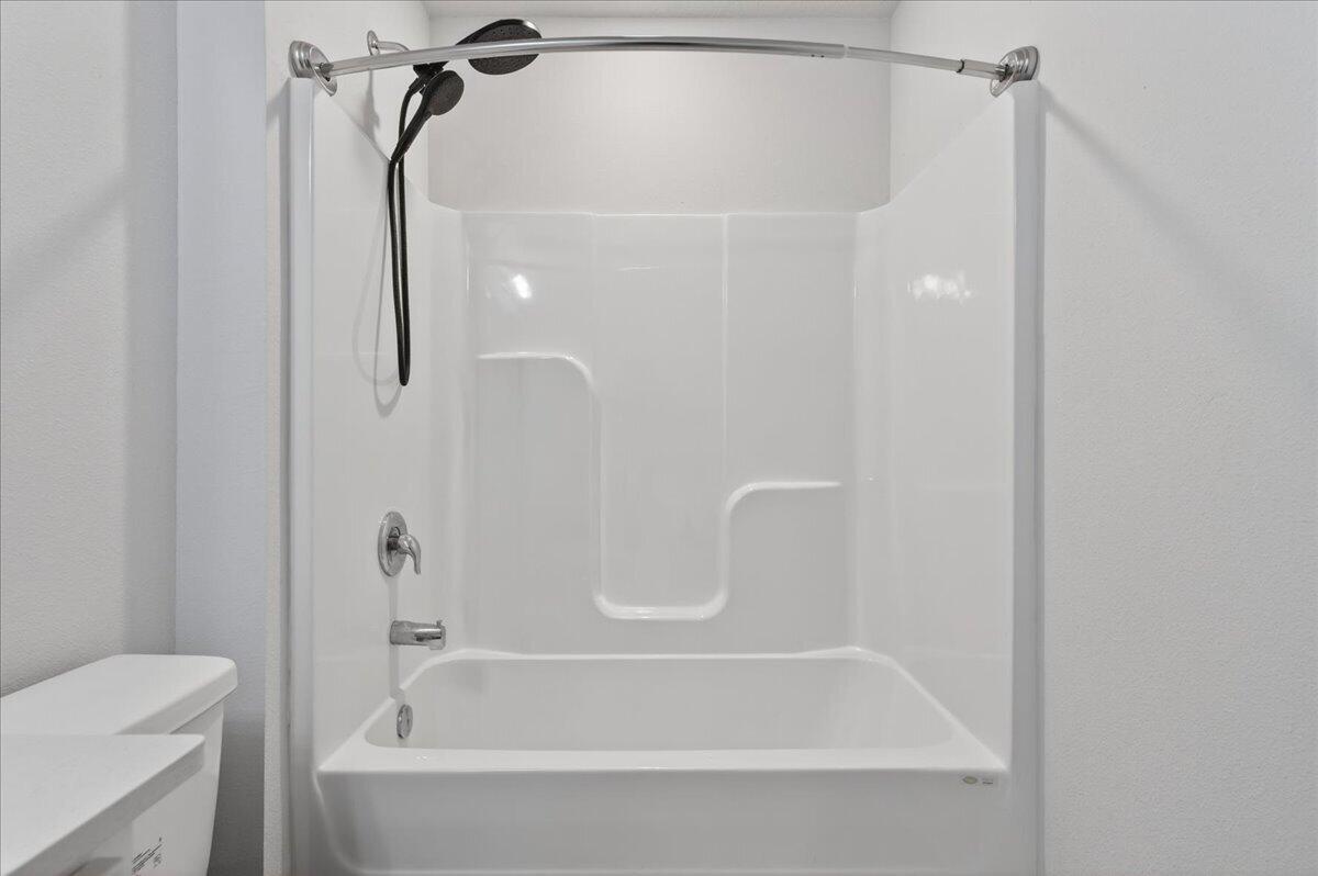 2808 Tallgrass Court Crestview, FL 32536 - Photo 32 of 49 a bathroom with a bath tub with a shower