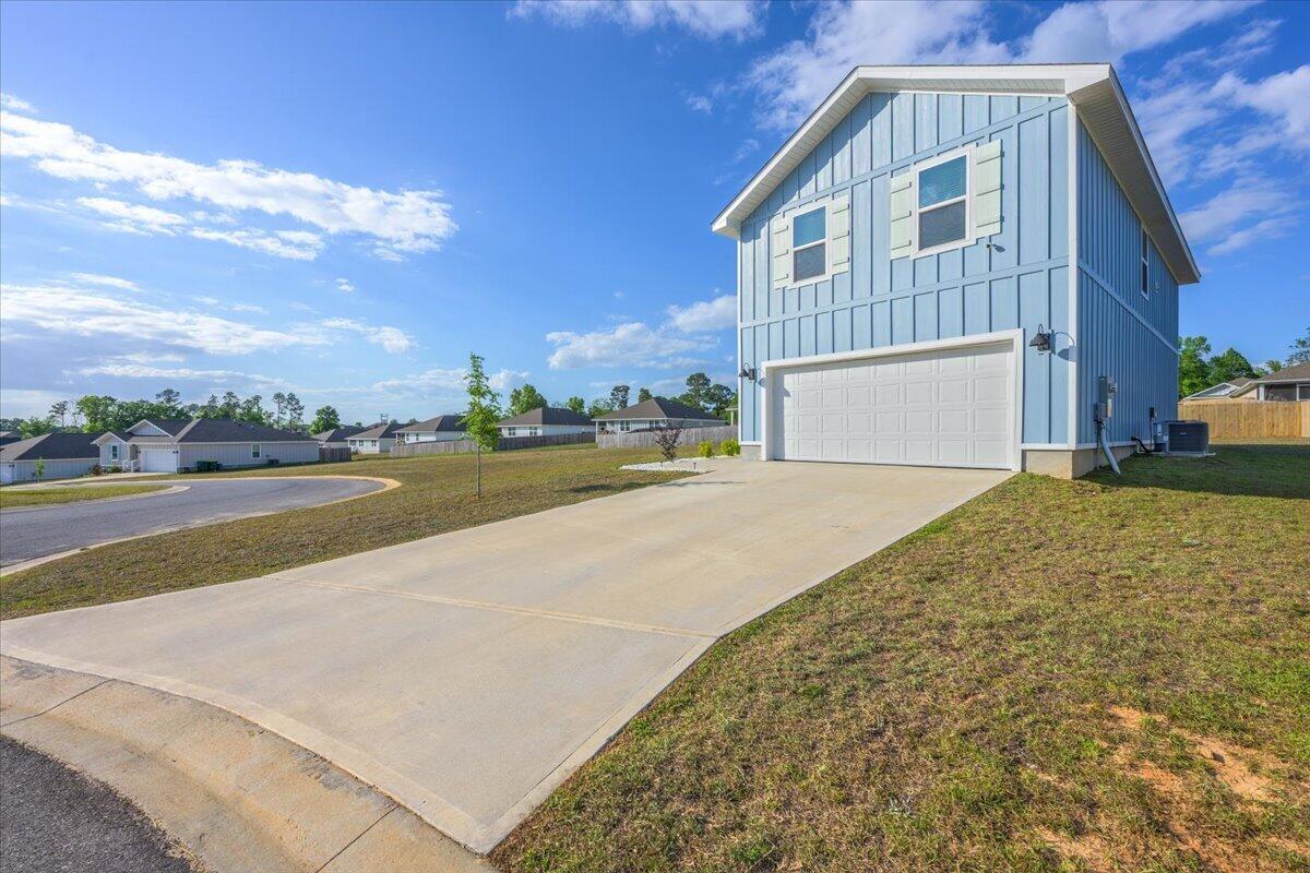 2808 Tallgrass Court Crestview, FL 32536 - Photo 45 of 49 a view of an house with backyard and road