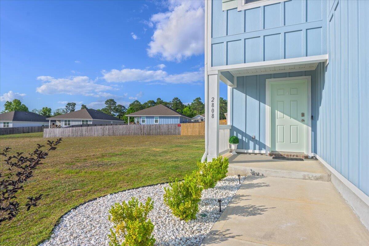 2808 Tallgrass Court Crestview, FL 32536 - Photo 48 of 49 a view of a patio with a table and chairs