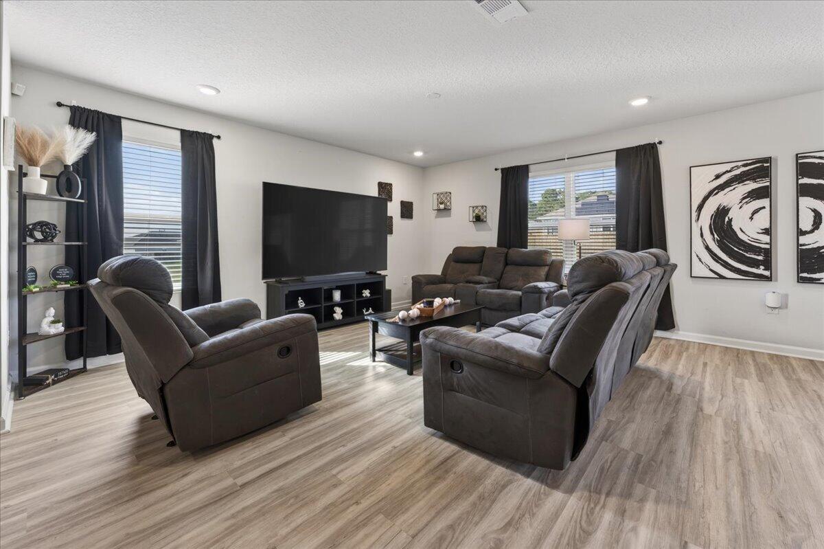 2808 Tallgrass Court Crestview, FL 32536 - Photo 5 of 49 a living room with furniture and a flat screen tv