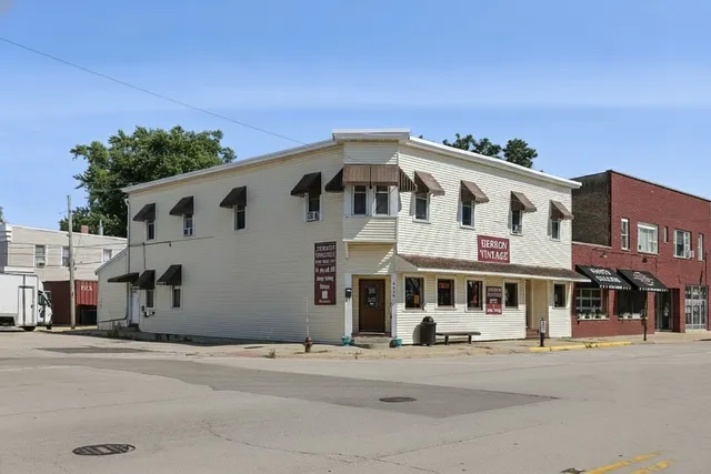a front view of a building with a road