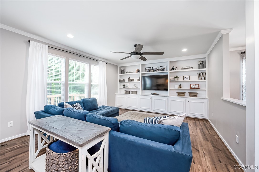 8006 Bole Hat Road Chesterfield, VA 23832 - Photo 14 of 47 Living area featuring crown molding, dark wood-typ