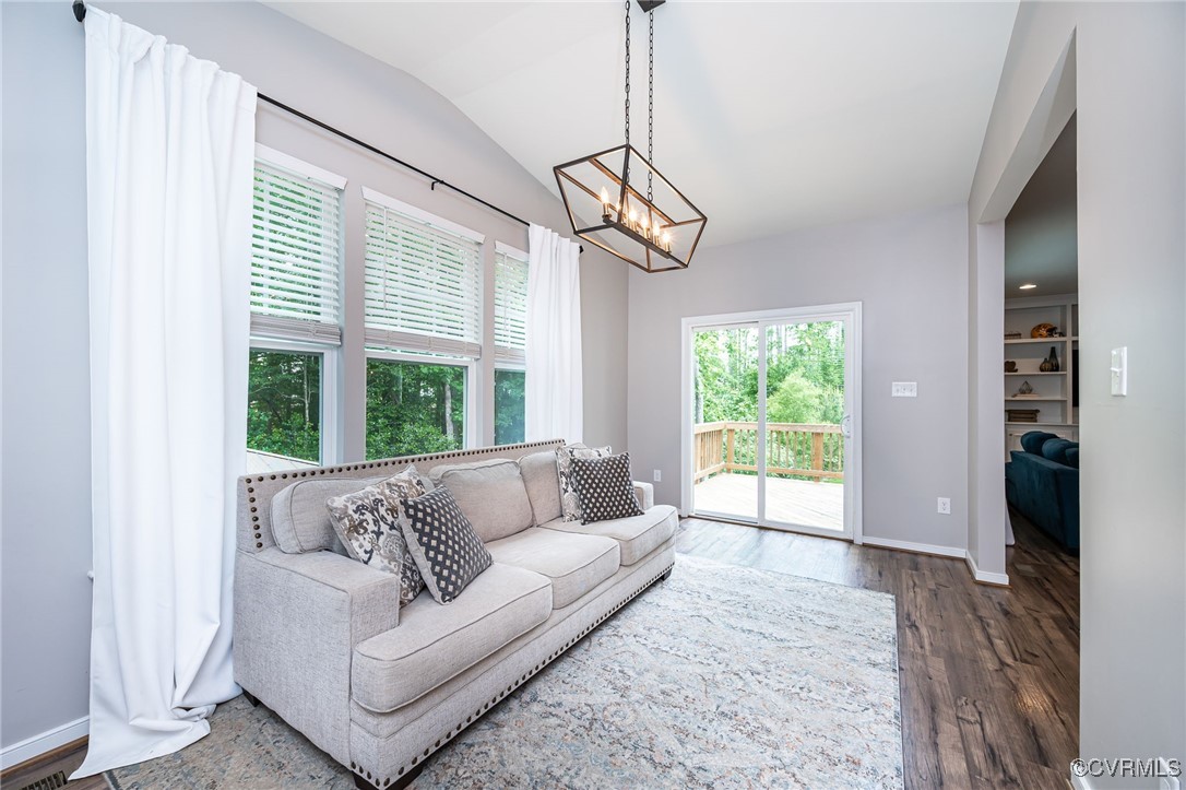 8006 Bole Hat Road Chesterfield, VA 23832 - Photo 23 of 47 Living room with vaulted ceiling, a chandelier, wo