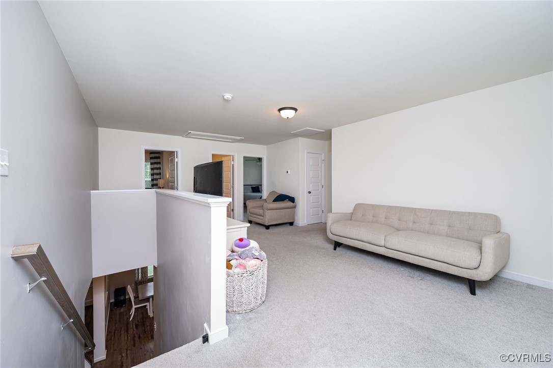 8006 Bole Hat Road Chesterfield, VA 23832 - Photo 24 of 47 Living area with carpet flooring, baseboards, and