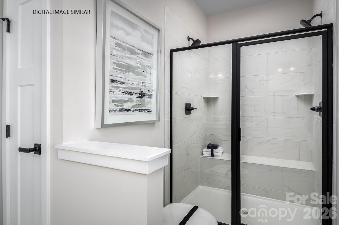 2287 Flicker Road, Unit 1050A Indian Land, SC 29707 - Photo 7 of 13 a bathroom with a shower and a sink