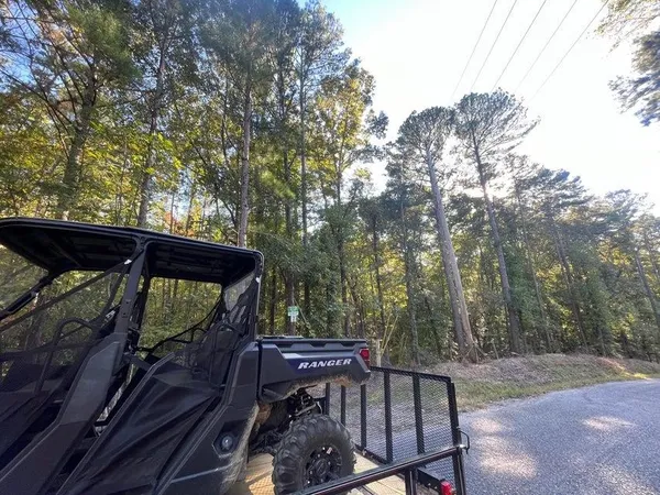 a view of a roof deck with wooden fence and floor