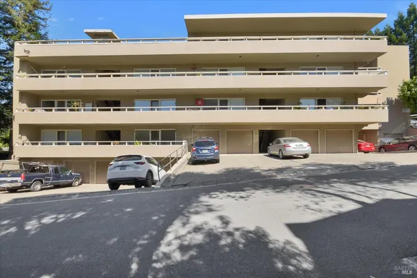 a view of parking and a building