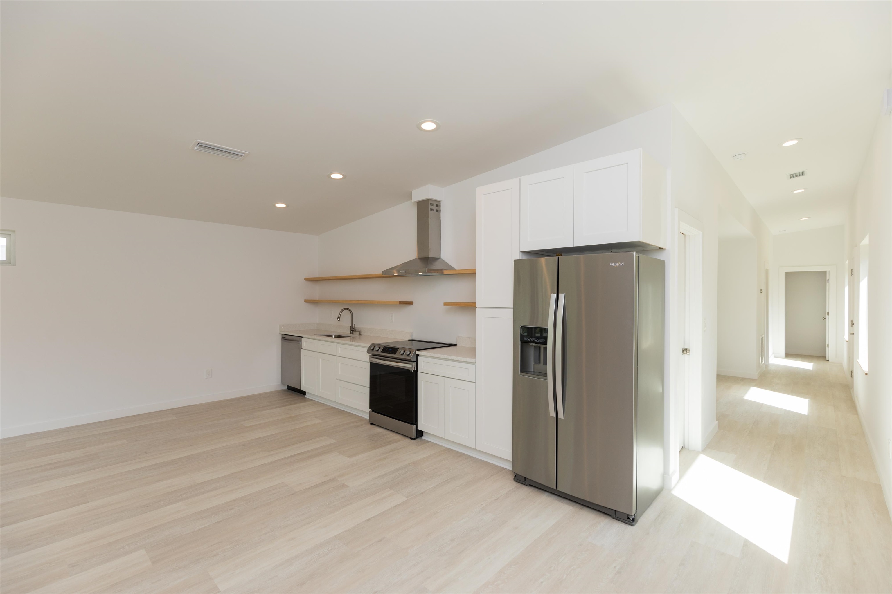 561 Live Oak Street St. Augustine, FL 32084 - Photo 11 of 30 a kitchen with a refrigerator and a stove top oven