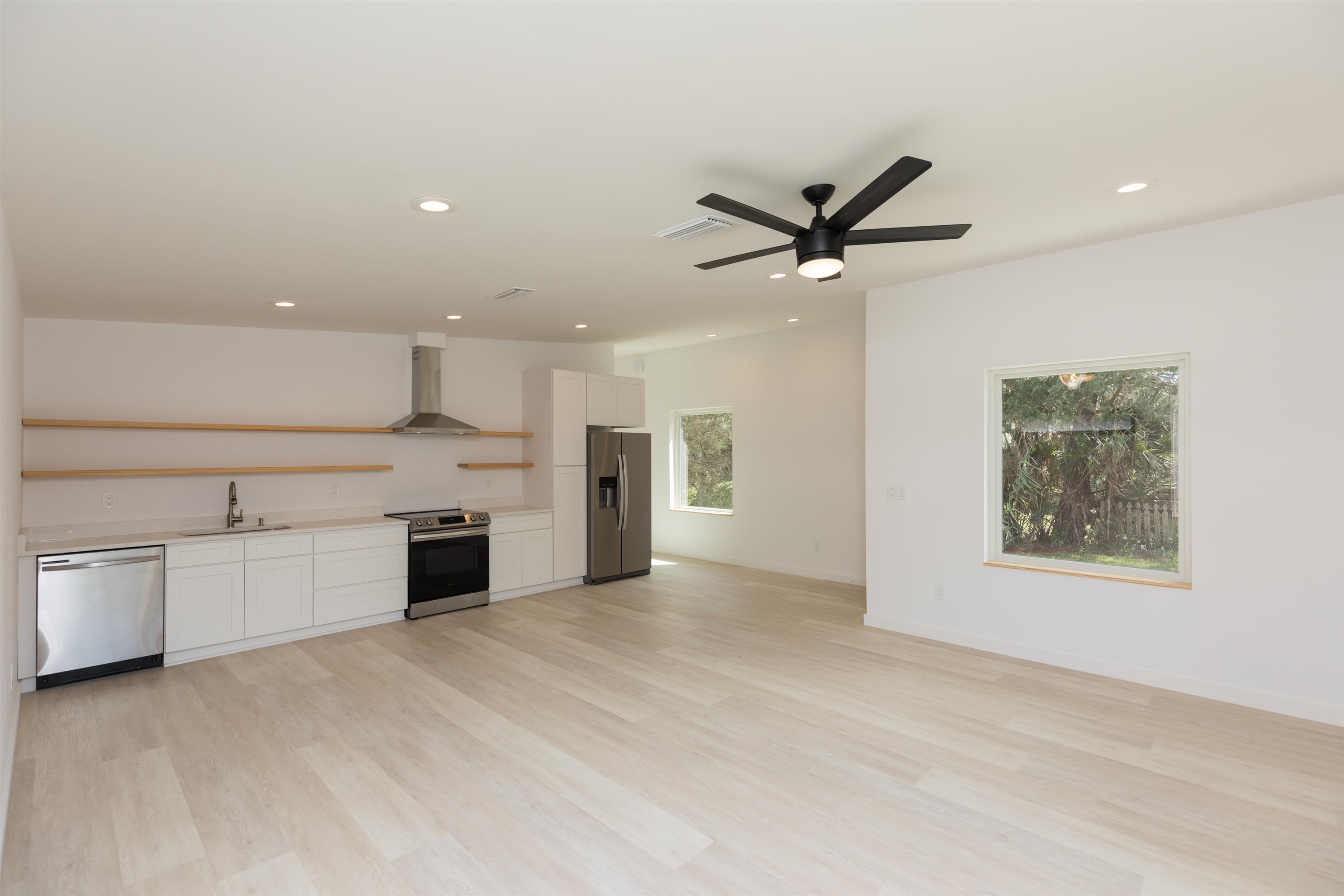 561 Live Oak Street St. Augustine, FL 32084 - Photo 15 of 30 a view of a kitchen with a sink and a stove top oven