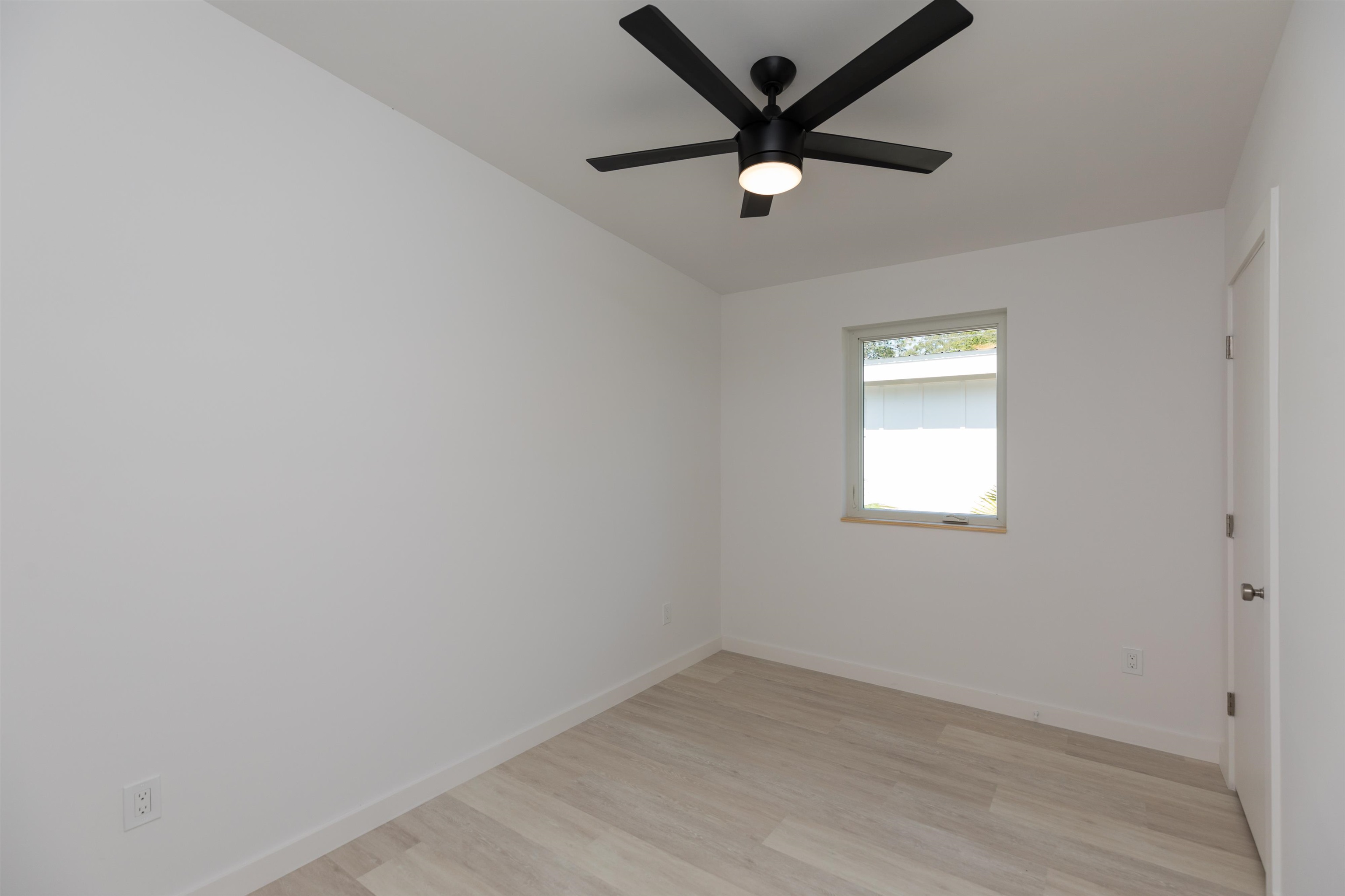 561 Live Oak Street St. Augustine, FL 32084 - Photo 17 of 30 an empty room with a window and a fan