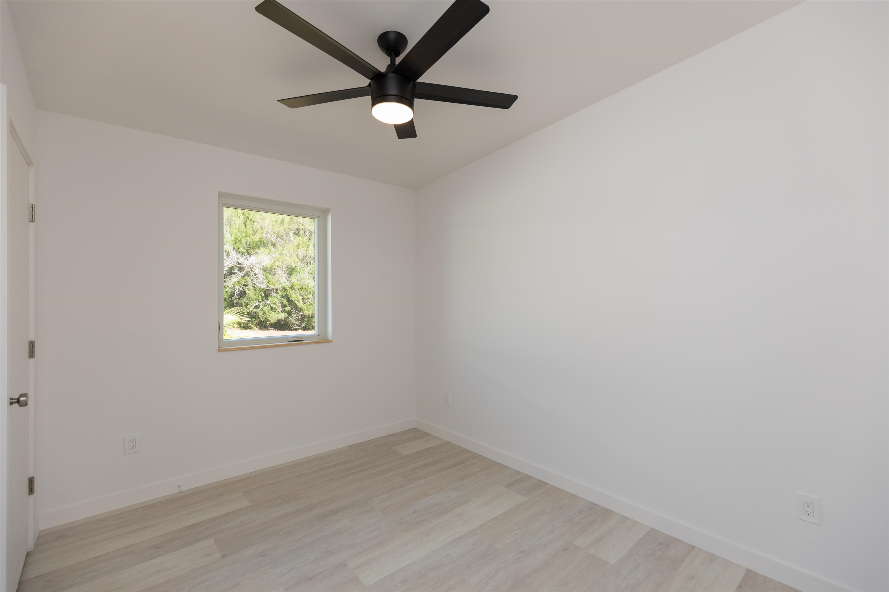 561 Live Oak Street St. Augustine, FL 32084 - Photo 19 of 30 an empty room with a window and a fan