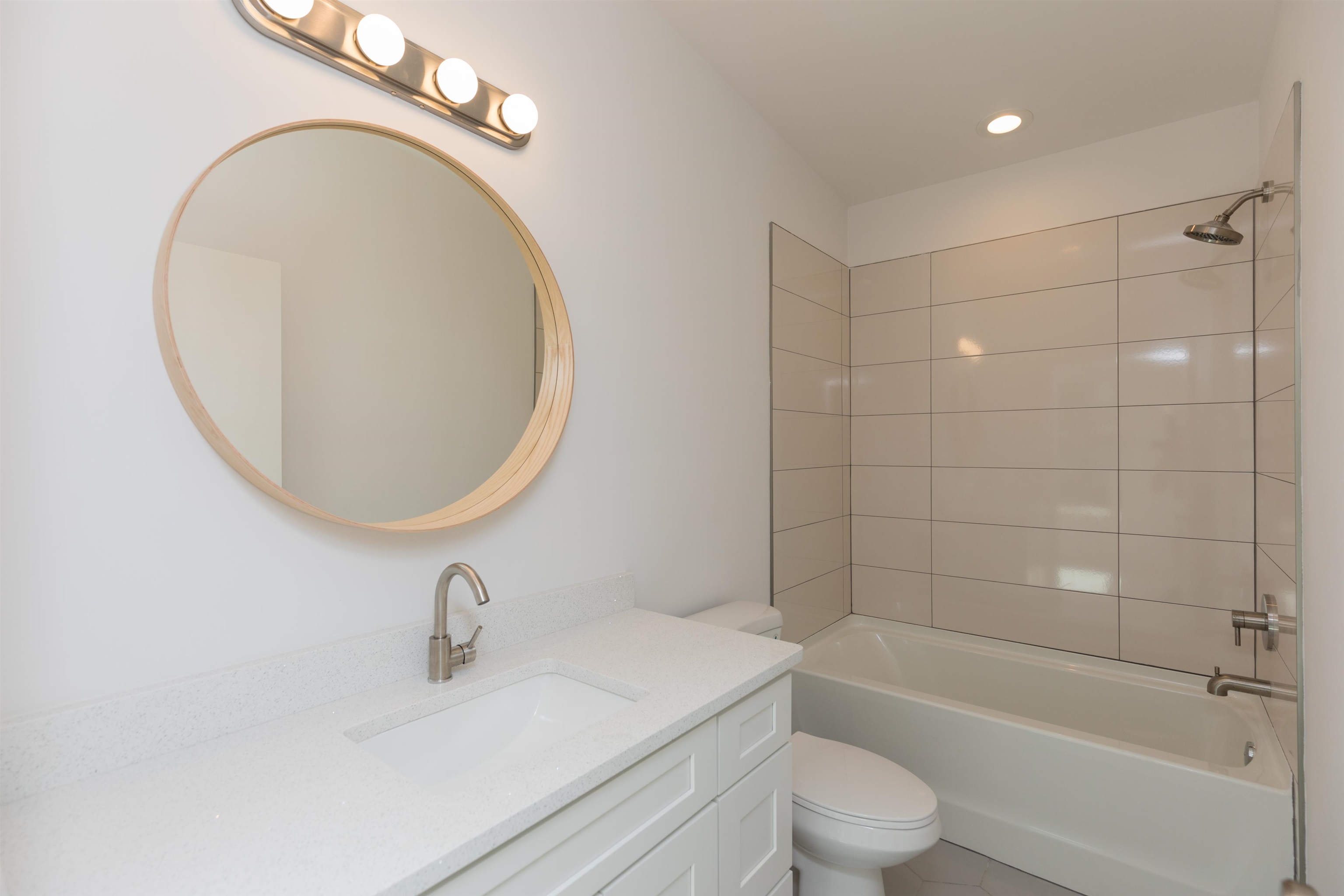 561 Live Oak Street St. Augustine, FL 32084 - Photo 21 of 30 a bathroom with a sink a toilet and a mirror