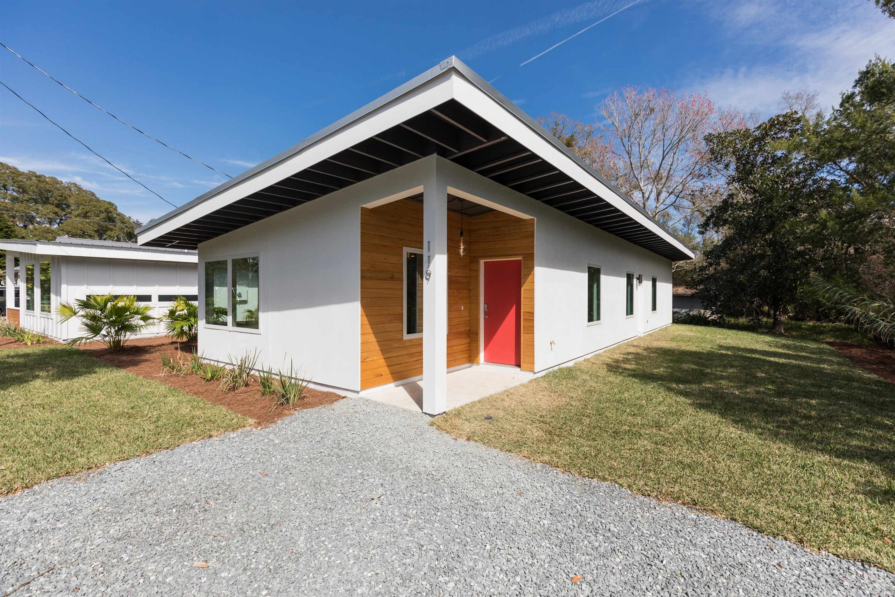 561 Live Oak Street St. Augustine, FL 32084 - Photo 4 of 30 a front view of a house with garden