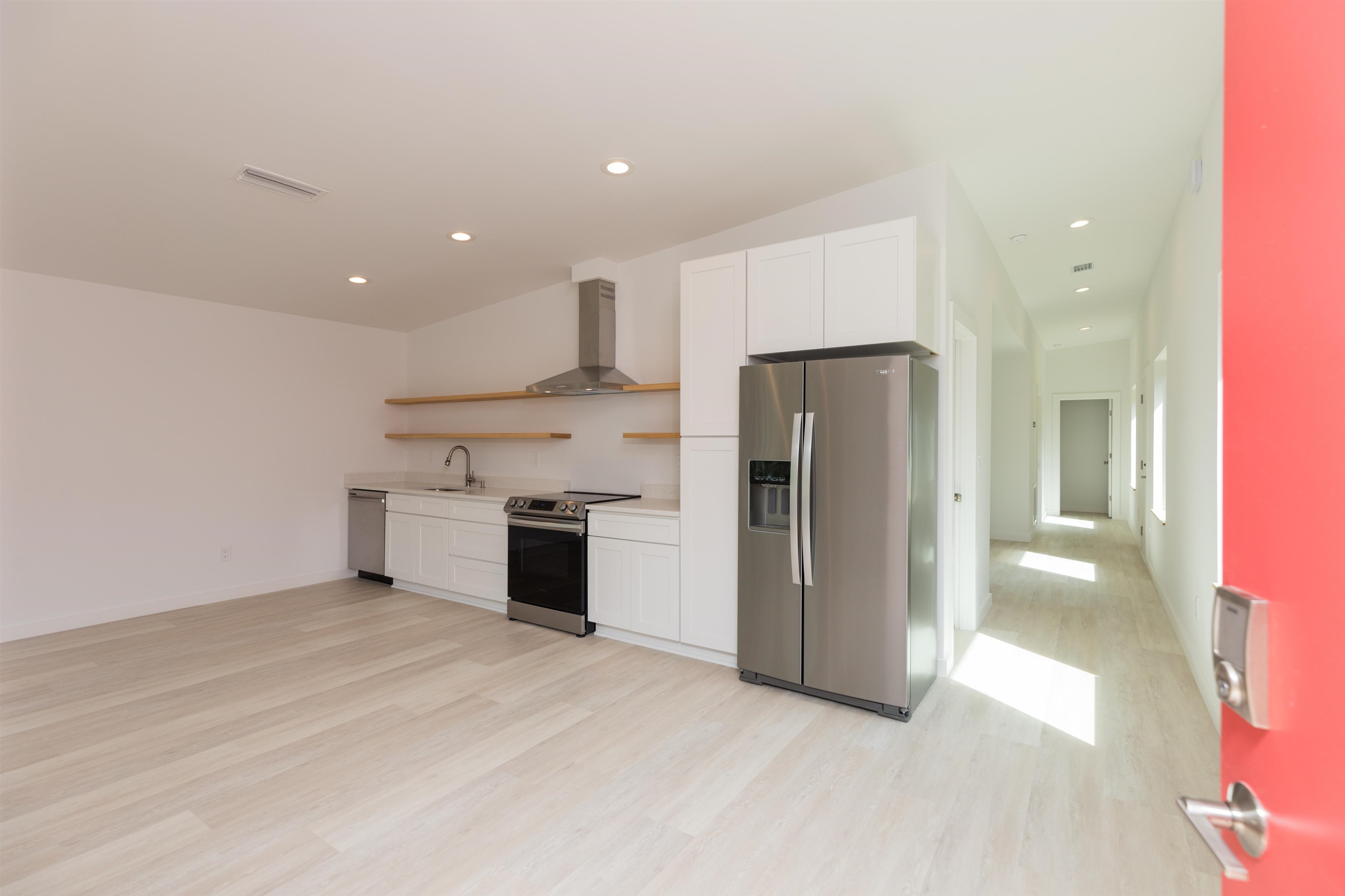 561 Live Oak Street St. Augustine, FL 32084 - Photo 7 of 30 a view of a kitchen with a sink and a stove