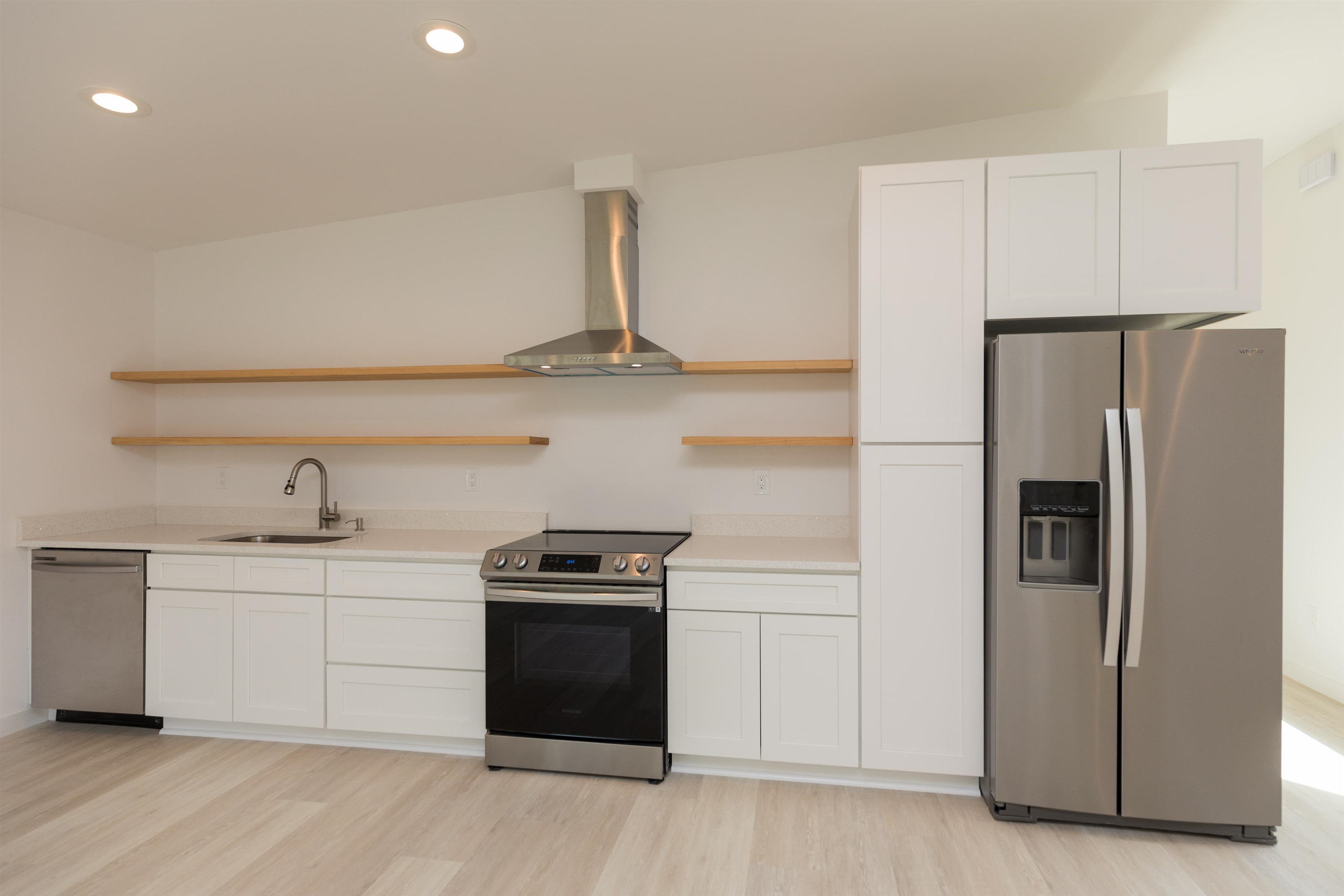 561 Live Oak Street St. Augustine, FL 32084 - Photo 8 of 30 a kitchen with stainless steel appliances a sink and a refrigerator
