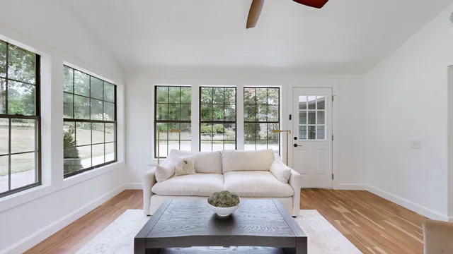 a living room with furniture and a window