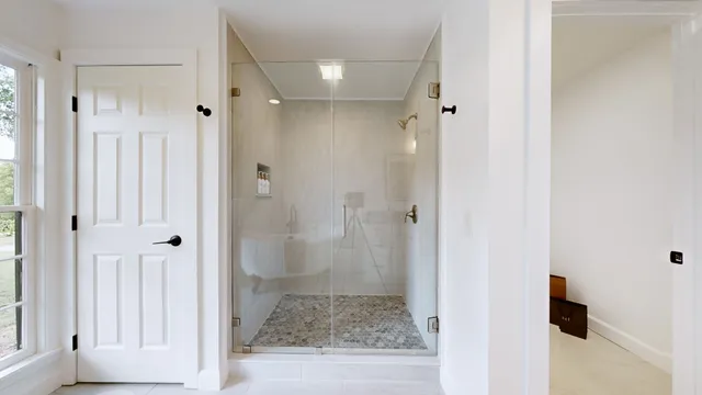 a bathroom with a shower and toilet