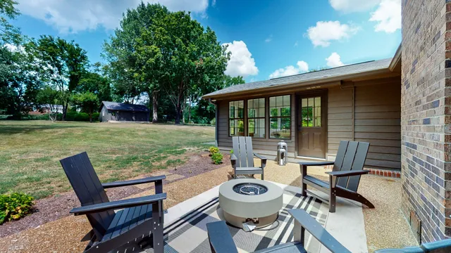a view of a patio with garden