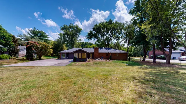a big yard with large trees