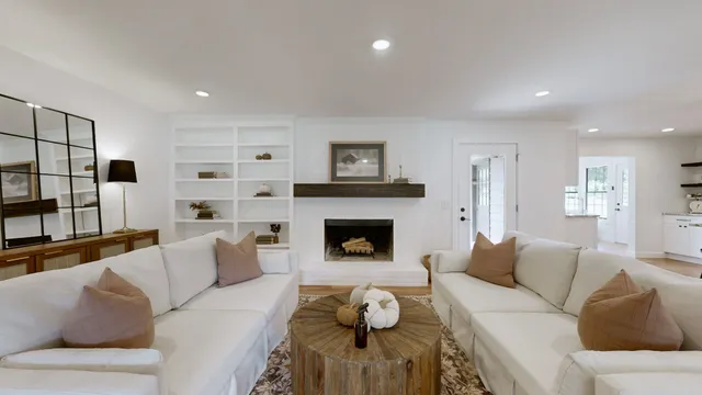 a living room with furniture and a fireplace