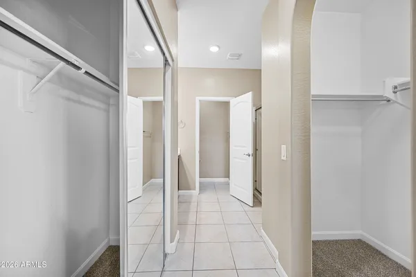 a bathroom with a shower and a glass door