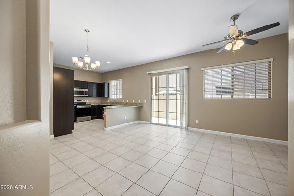a view of a kitchen with furniture and chandelier