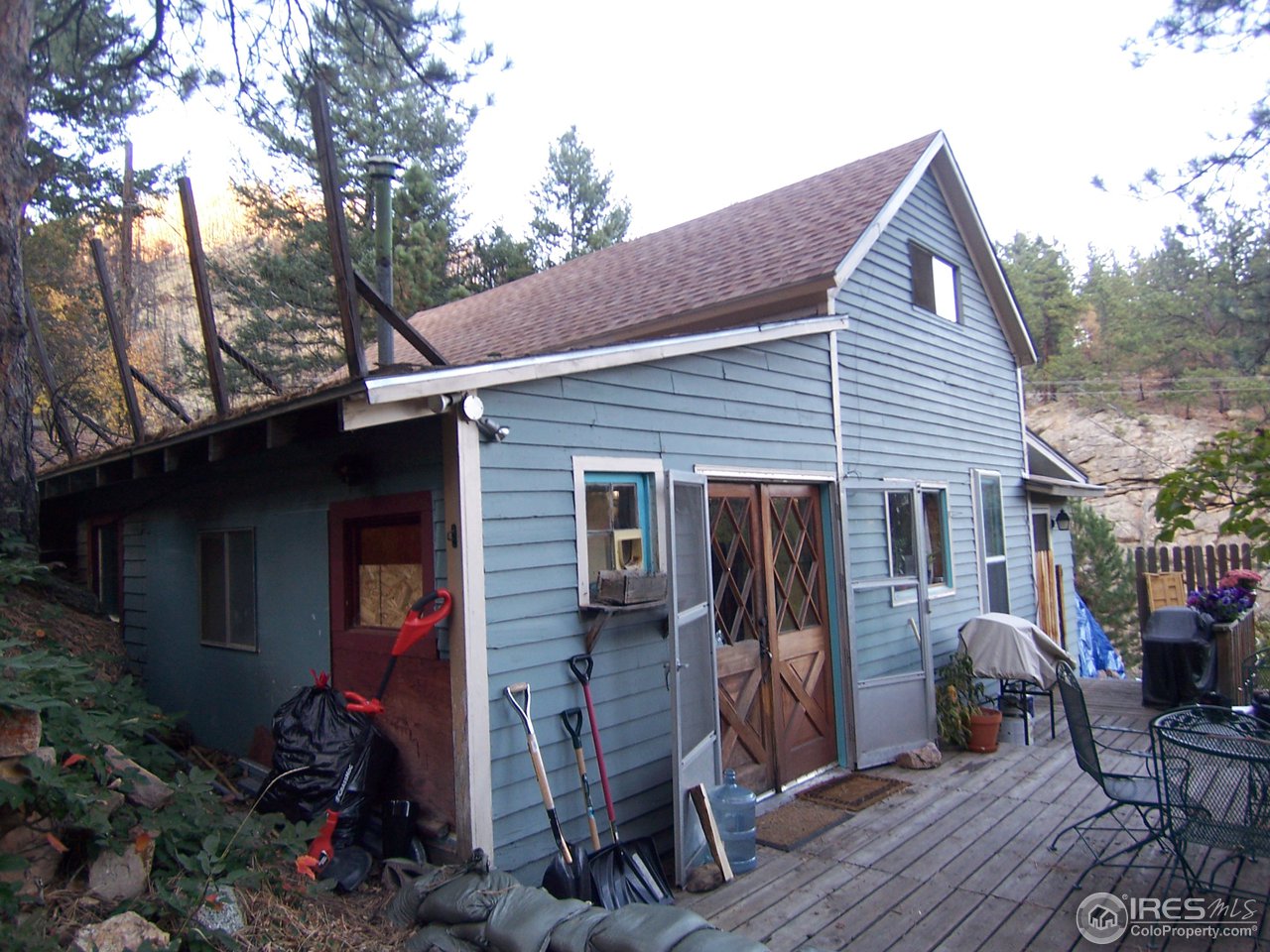 a view of backyard of house with seating space