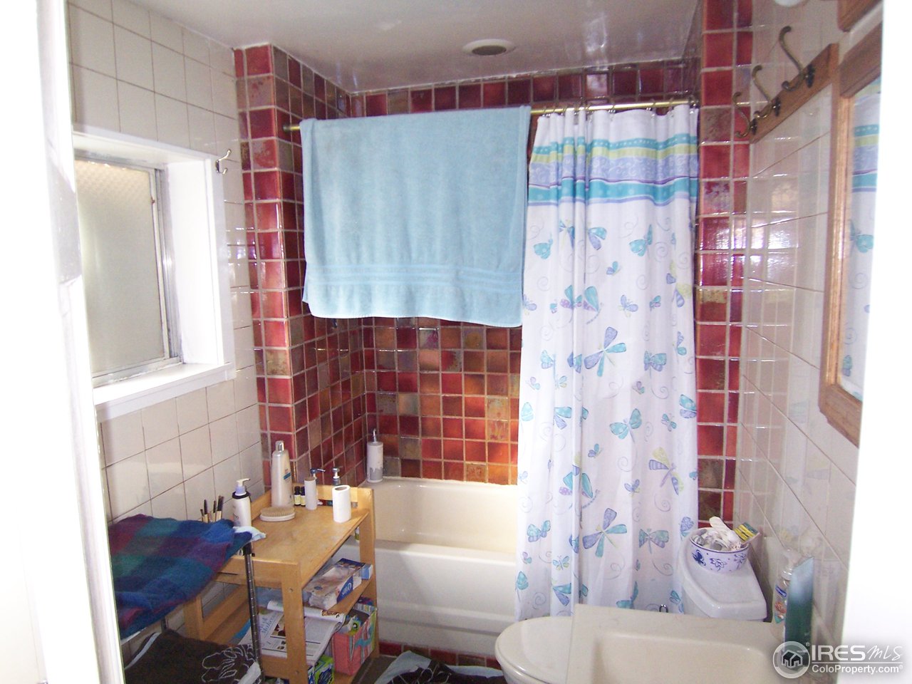 223 Gold Run Road Boulder, CO 80302 - Photo 11 of 18 a bathroom with a toilet and a shower curtain