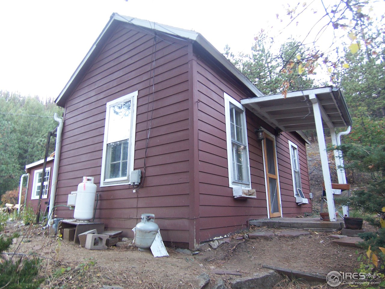 223 Gold Run Road Boulder, CO 80302 - Photo 13 of 18 a front view of a house with a yard
