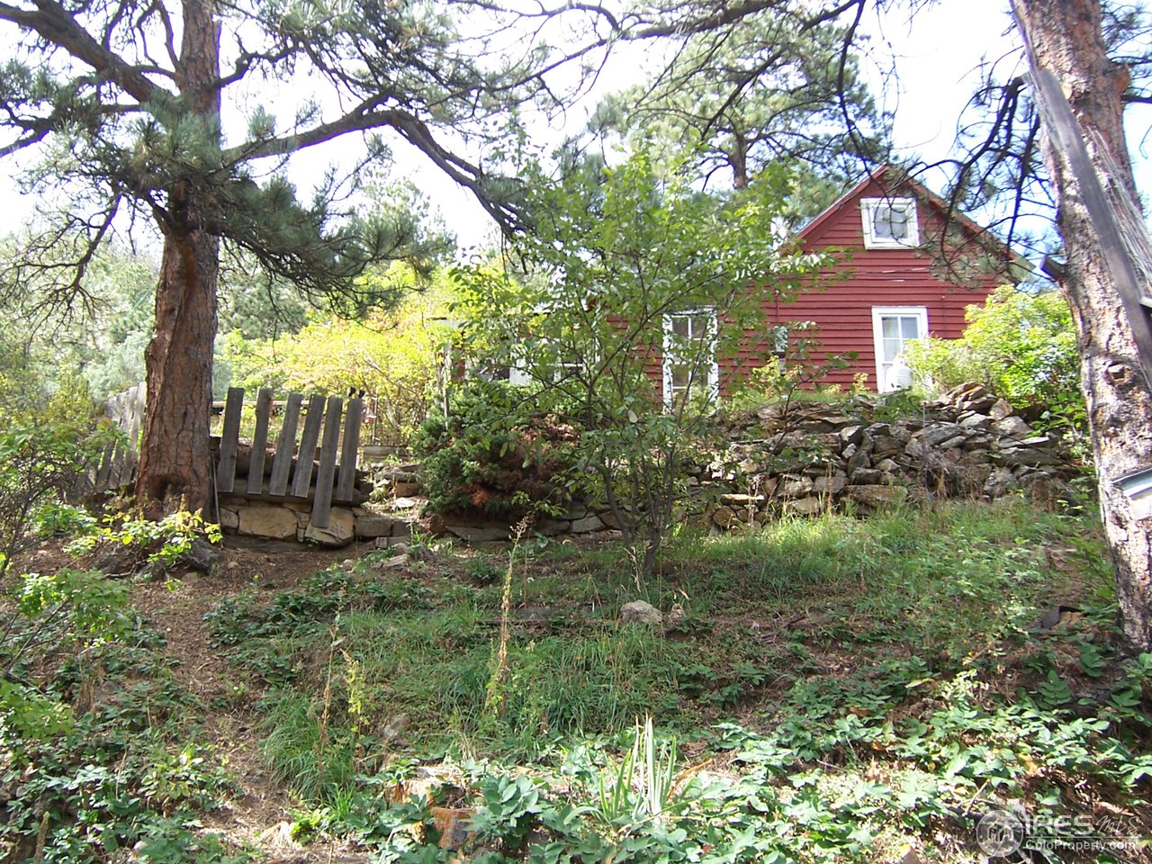 223 Gold Run Road Boulder, CO 80302 - Photo 14 of 18 a brick building with green trees in front of it