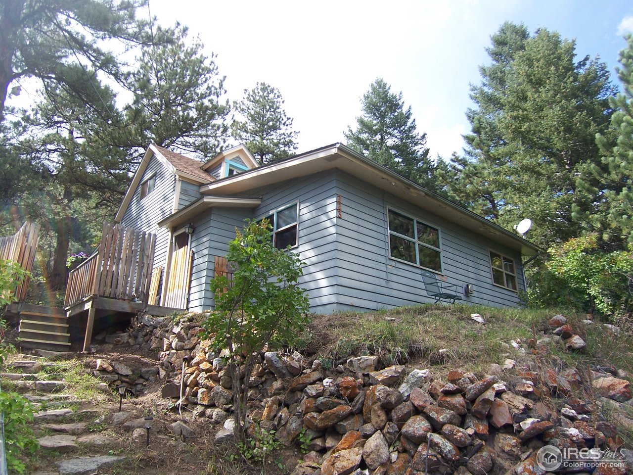 223 Gold Run Road Boulder, CO 80302 - Photo 2 of 18 a backyard of a house with lots of green space