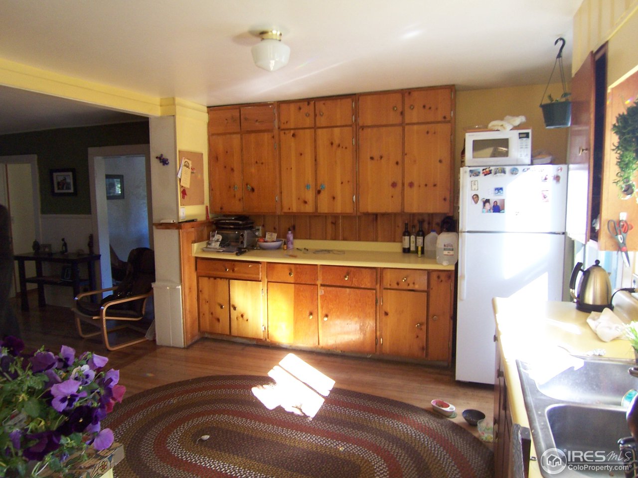 223 Gold Run Road Boulder, CO 80302 - Photo 6 of 18 a kitchen with refrigerator and cabinets
