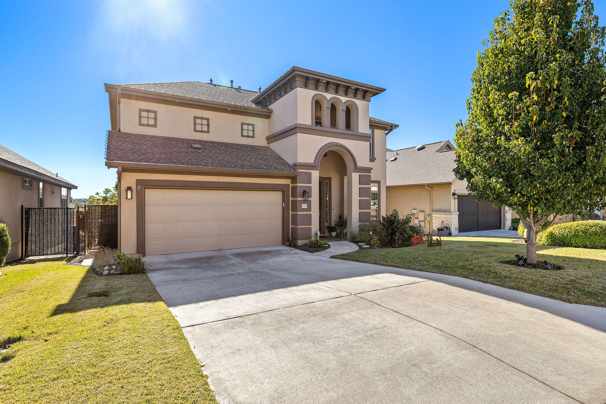4413 Tambre Bend Austin, TX 78738 - Photo 29 of 30 Mediterranean / spanish home with a front yard, stucco siding, driveway, and a shingled roof