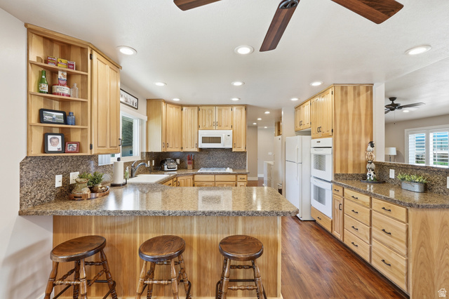 2420 West Old Hwy Road Morgan, UT 84050 - Photo 15 of 54 Kitchen featuring a peninsula, a kitchen breakfast bar, ceiling fan, and recessed lighting
