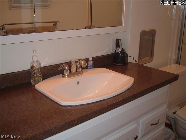 470 Stanley Road Akron, OH 44312 - Photo 9 of 18 Updated sink, counter and cabinet, along with new hardwood floor