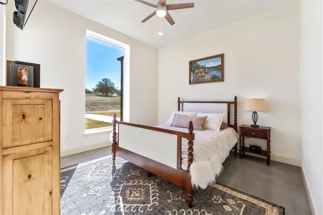 a bed room with a bed and a tv