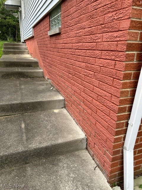 6833 East Pleasant Valley Road Independence, OH 44131 - Photo 4 of 30 Staircase featuring brick foundation wall